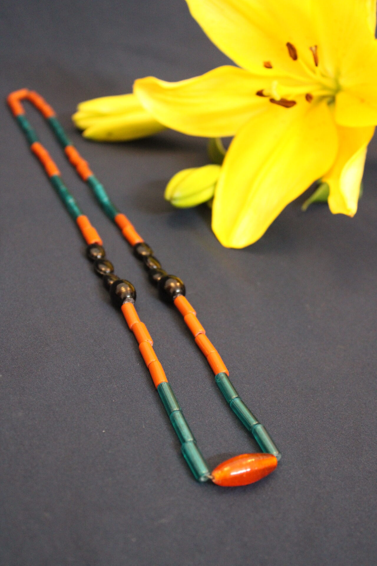 Trendy kongsang, big orangish chamthei in the middle combined with black chamthei, green and brownish orange tube, 1 line handmade kongsang