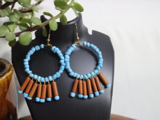 Stunning round earring with blue beads covering the ring | seven strings with small brown pipes and small blue beads