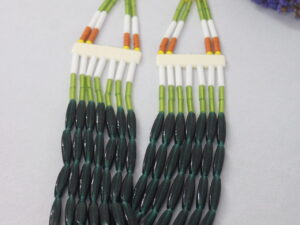 Fashionable seven line kongsang loaded with big green chamthei, green, white and orange pipes