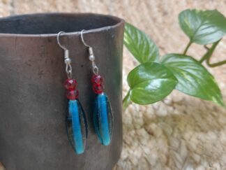 Modern earring with big turquoise beads with two small red beads
