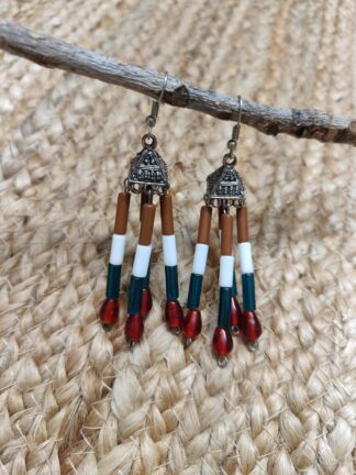 Silver Jhumka earring mixed with traditional style, four strings with brown, white and green tubes, finished with red beads